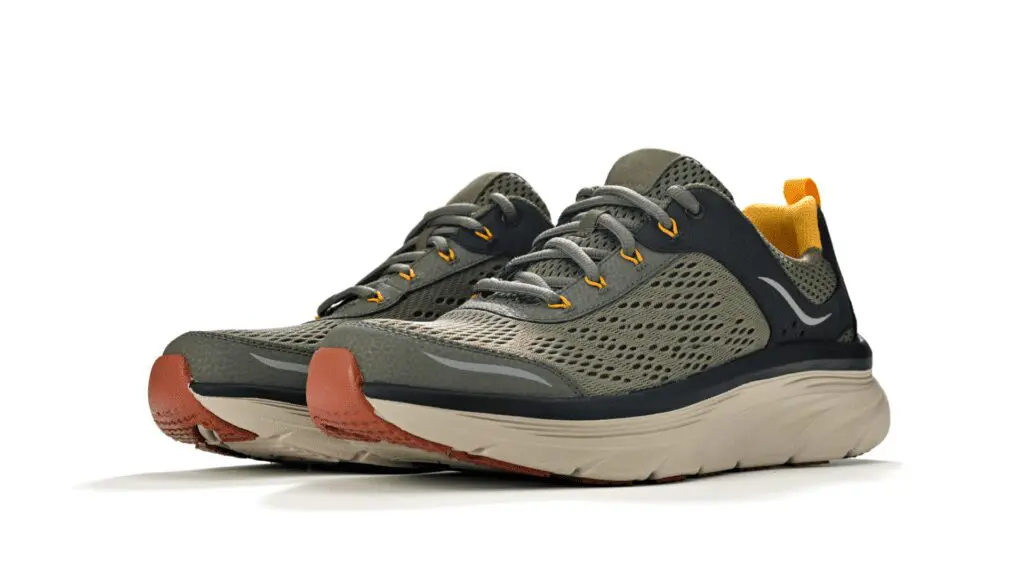 A pair of olive green and black running shoes with orange accents and a beige sole, displayed against a white background.