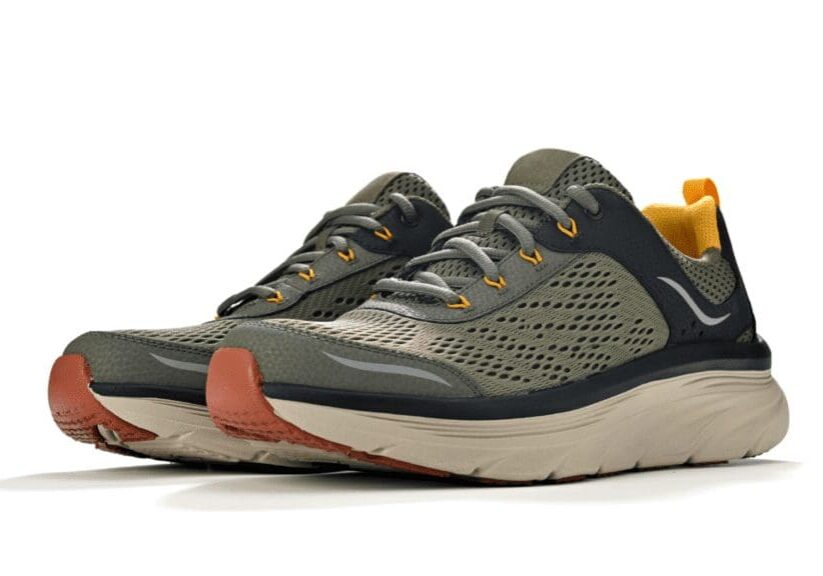 A pair of olive green and black running shoes with orange accents and a beige sole, displayed against a white background.